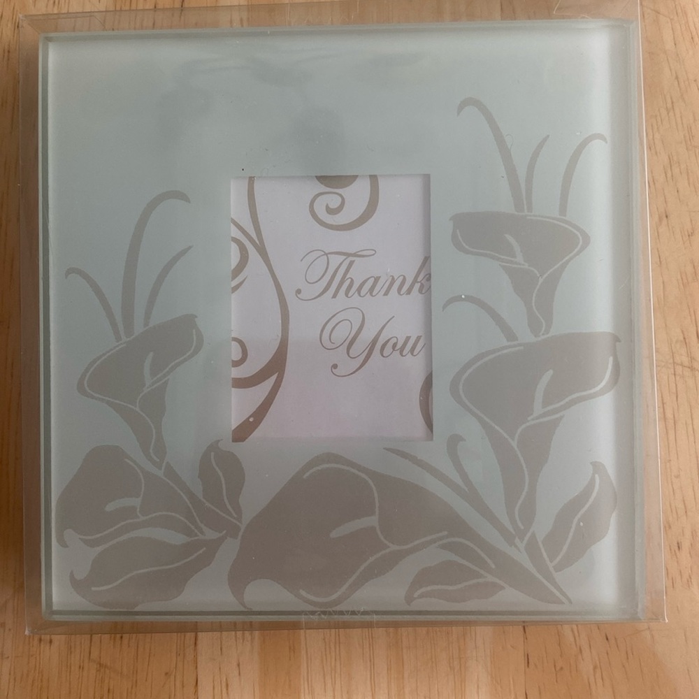 NWT set of 2 glass coasters that have area to put in a picture. New in package